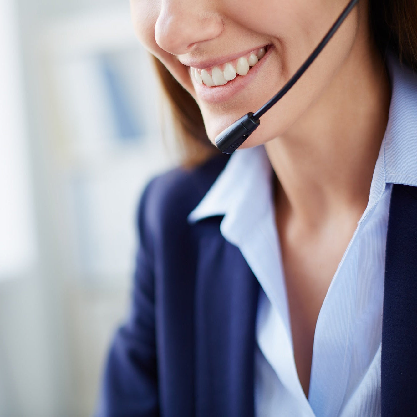 Woman wearing a headset with a blurred office background
this is for namostey contact us
